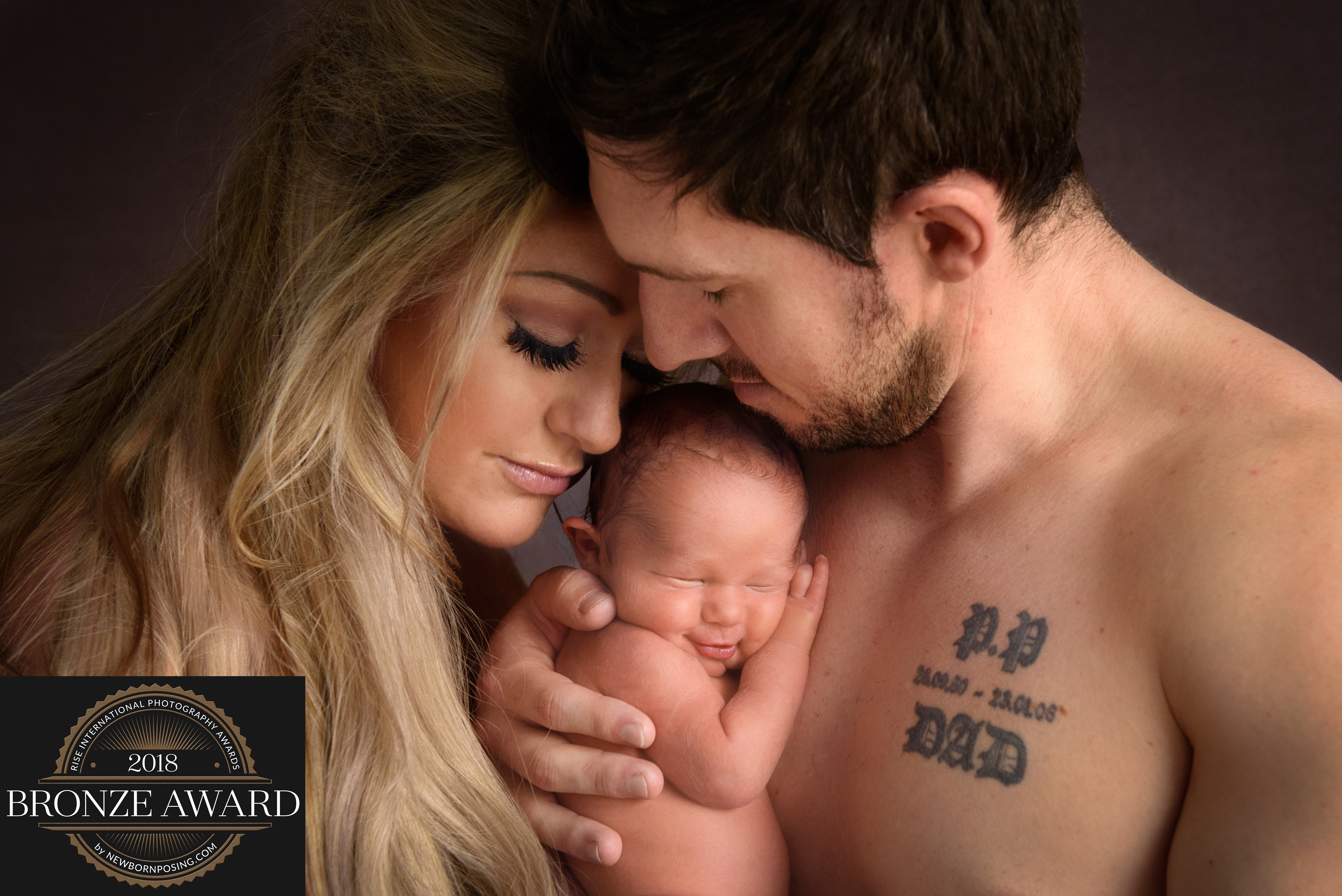 Award winning image by Jackie Newborn baby photography by Babies By Jackie near York, Selby, Howden, Market Weighton, Beverley, Pocklington and Hull. Photo of new parents with baby boy
